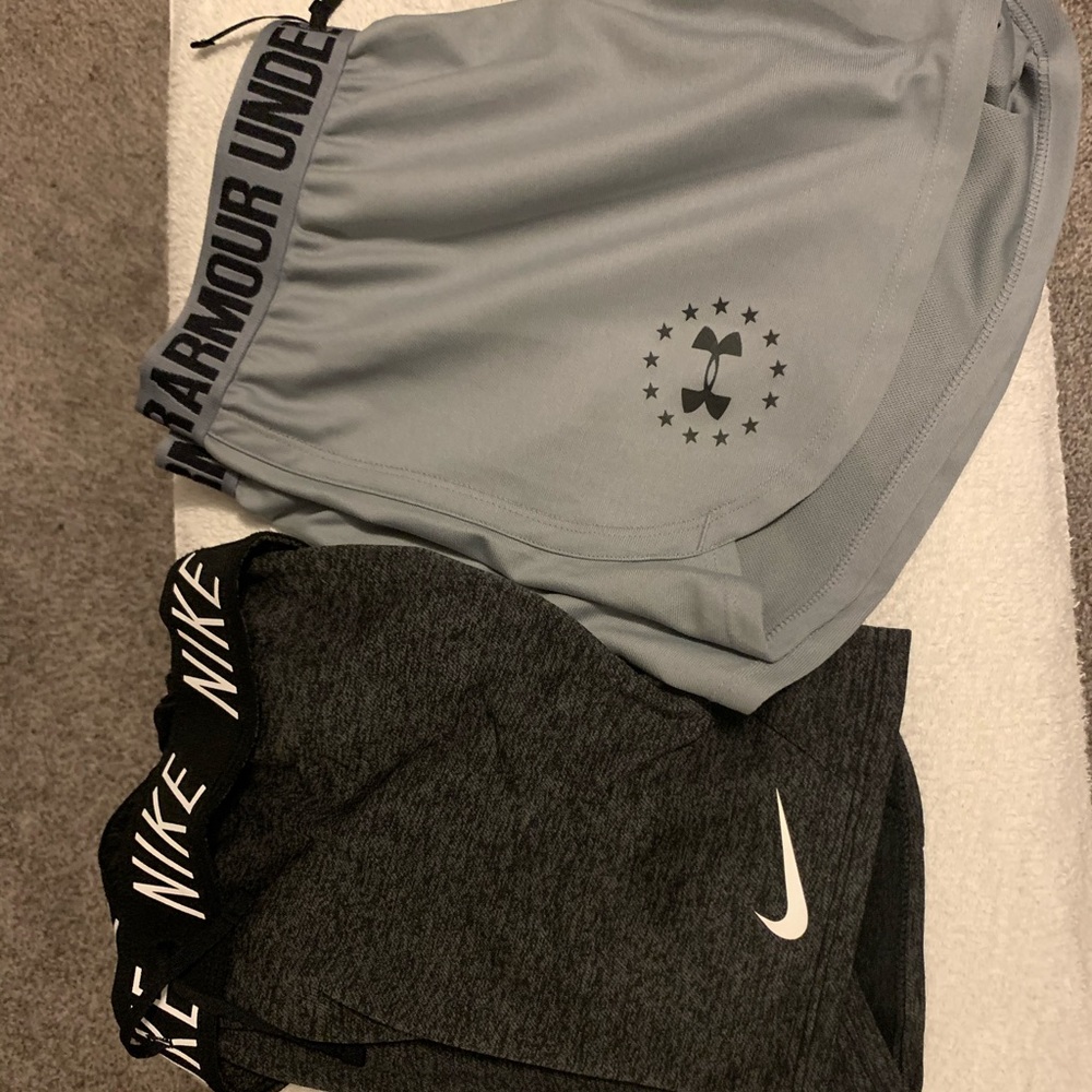 One Nike shorts/one under armor shorts together